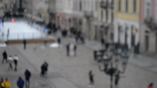 Abstract Defocused Blurred Background of many people on street square