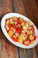 Delicious dish of zucchini and sausages