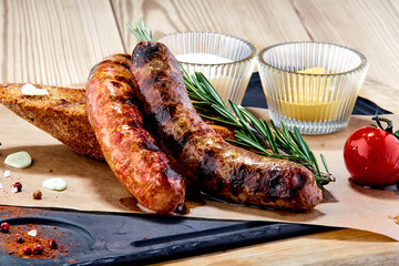 minced homemade sausages with toast on a table