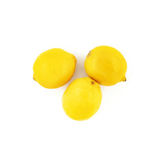 Three lemons isolated on white background. Creative healthy food concept. Top view.