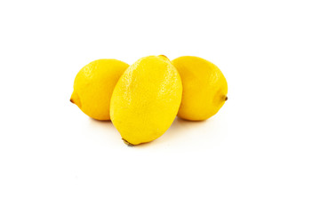 Three lemons isolated on white background. Creative healthy food concept. Flat lay.