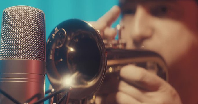 Musician playing and recording on Trumpet at home studio. Jazz, Blues, Rock, Pop Music style. Artist hobby, Create own melodies and songs, learning online. 4K video.