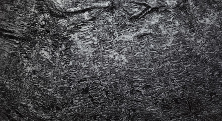 Black synthetic fabric with a pile.