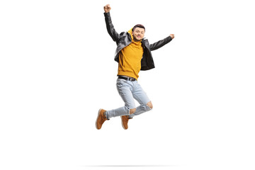 Trendy cool guy jumping and raising arms