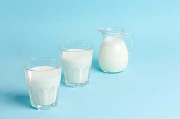 Home-made fermented drink - kefir or Bulgaros on a blue background with copy space.