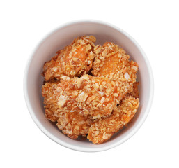Bucket with yummy fried nuggets isolated on white, top view