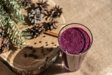 currant smoothie, purple, on a beige background