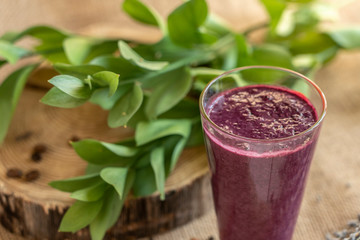 currant smoothie, purple, on a beige background