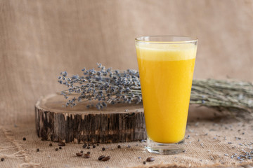 yellow smoothie with lavender bouquet