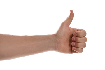Man showing thumb up gesture against white background, closeup of hand