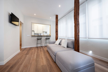 living room with exposed wooden beams in gray tones