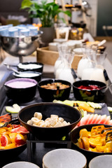 Selection of self service catering continental breakfast buffet display, catering or brunch table