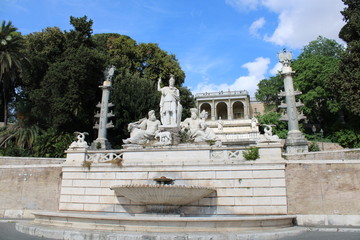 Fototapeta na wymiar fountain and statures in Piazza del Popolo rome city center italy