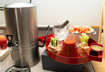 Salty bloody mary cocktail display with tomatoes and ice