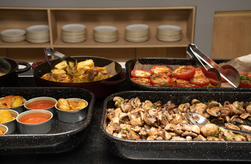 Selection of self service catering continental breakfast buffet display, catering or brunch table