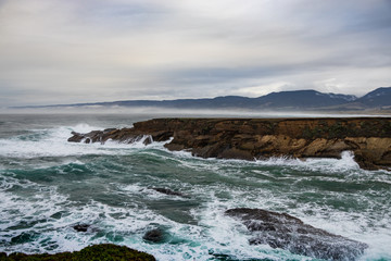 Fototapeta na wymiar Waves breaking on the California coastline