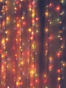 Illuminated String Lights On Wall At Night