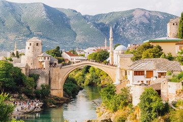 Fototapeta na wymiar Old Bridge Mosque and Neretva river in the Old Town of Mostar, Bosnia