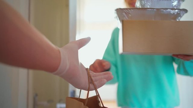 POV Man Courier Brings To Apartment And Gives Customer Order, Paper Box With Cake Or Pie And Plastic Container With Salad. Food Delivery During Quarantine, First Person View