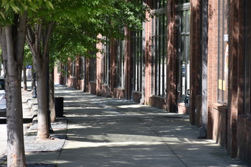Shaded sidewalk and urban landscape of the city