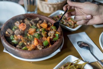 Beef meat with vegetables in casserole stew - Turkish delicious güveç