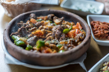 Beef meat with vegetables in casserole stew - Turkish delicious güveç
