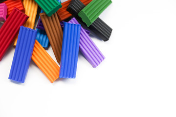 background with multicolored plasticine top view with white copy space