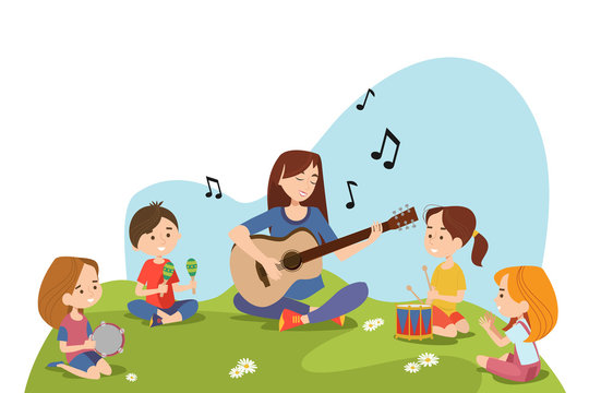 Children and teacher sitting on grass and playing musical instruments together. Kids enjoying outdoor music class. Daycare activities and musical education concept