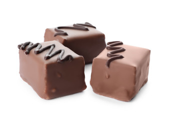 Delicious milk chocolate candies isolated on white