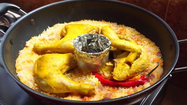 freshly cooked arabic chicken rice mandi with smoke real time 4k  footage
