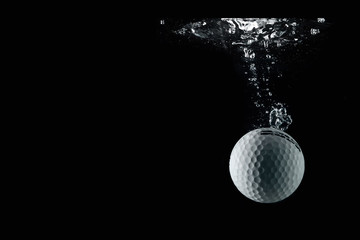 golf ball entering the water and splashing