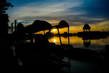 Naklejka na ściany i meble Gadsisar Sagar Lake in Jaisalmer Rajasthan, Sunrise at Gadsisar Sagar Lake 