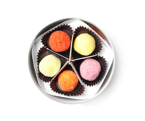 Box with tasty colorful chocolate candies isolated on white, top view