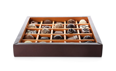 Box with tasty chocolate candies isolated on white