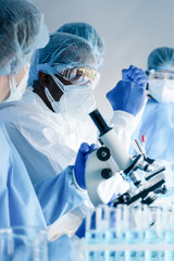 africam american biological research scientist and team working together in vaccine development...