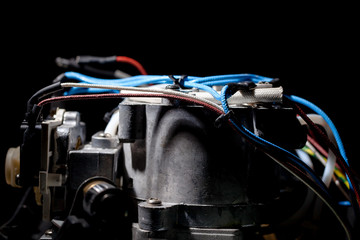 Insulated wiring on the metal part of a home appliance. The concept of home maintenance and...