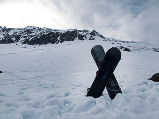 crossed snowboards on the mountain