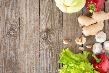 Assorted vegetables on a wooden background. Template for text, top view.
