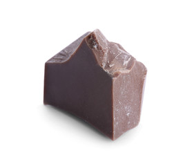 Piece of milk chocolate isolated on white
