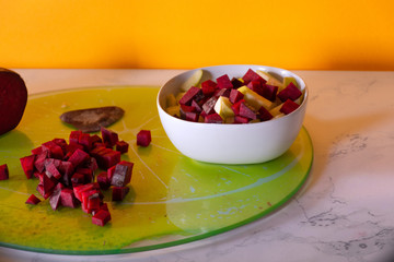 Close up of a bowl of chopped fruit at kitchen