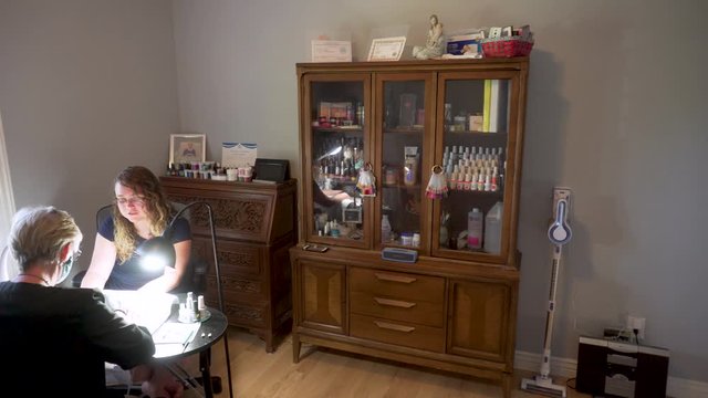 Young Woman Getting A Manicure At A Home Business Beauty Salon