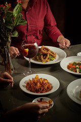 Table served with many dishes for share