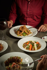 Table served with many dishes for share