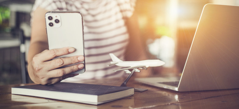 Woman check flight status on travel From an epidemic event Affecting businesses around the world, Investment, Stock market, Product business, Trading.