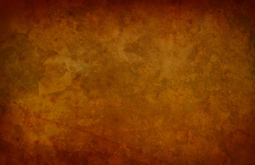 old orange grunge background texture with antique or vintage vignette border and marbled scratched old stone or rock design