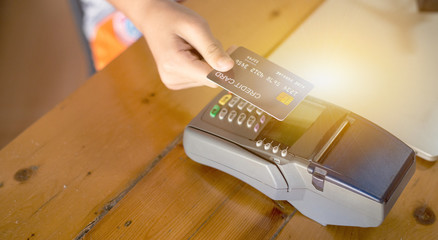 Payment for goods via the automatic credit card system Through wireless magnetic waves called electronic payment systems, Paywave, Contactless payment concept.