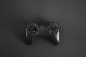 Gamepad in the middle of the black background.