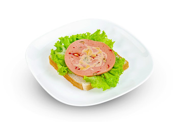 bologna sliced with bread and lettuce leaf isolated on white background