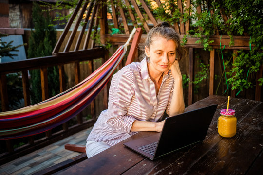 Woman With Laptop  In Backyard  Home Office