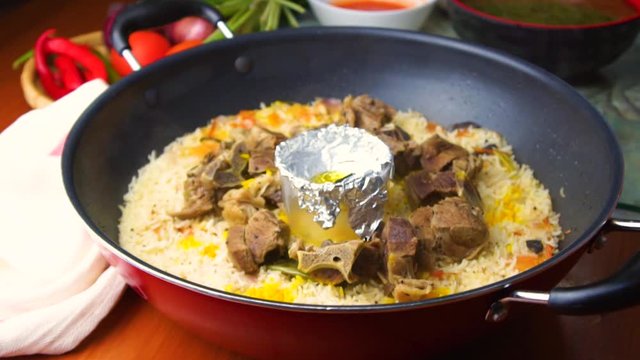 lamb stew with rice in the pan